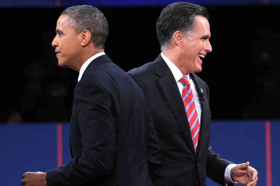 President Obama and GOP presidential nominee Mitt Romney walk away after they greet each other at the end of the third presidential debate in Boca Raton, Fla., on Monday.
