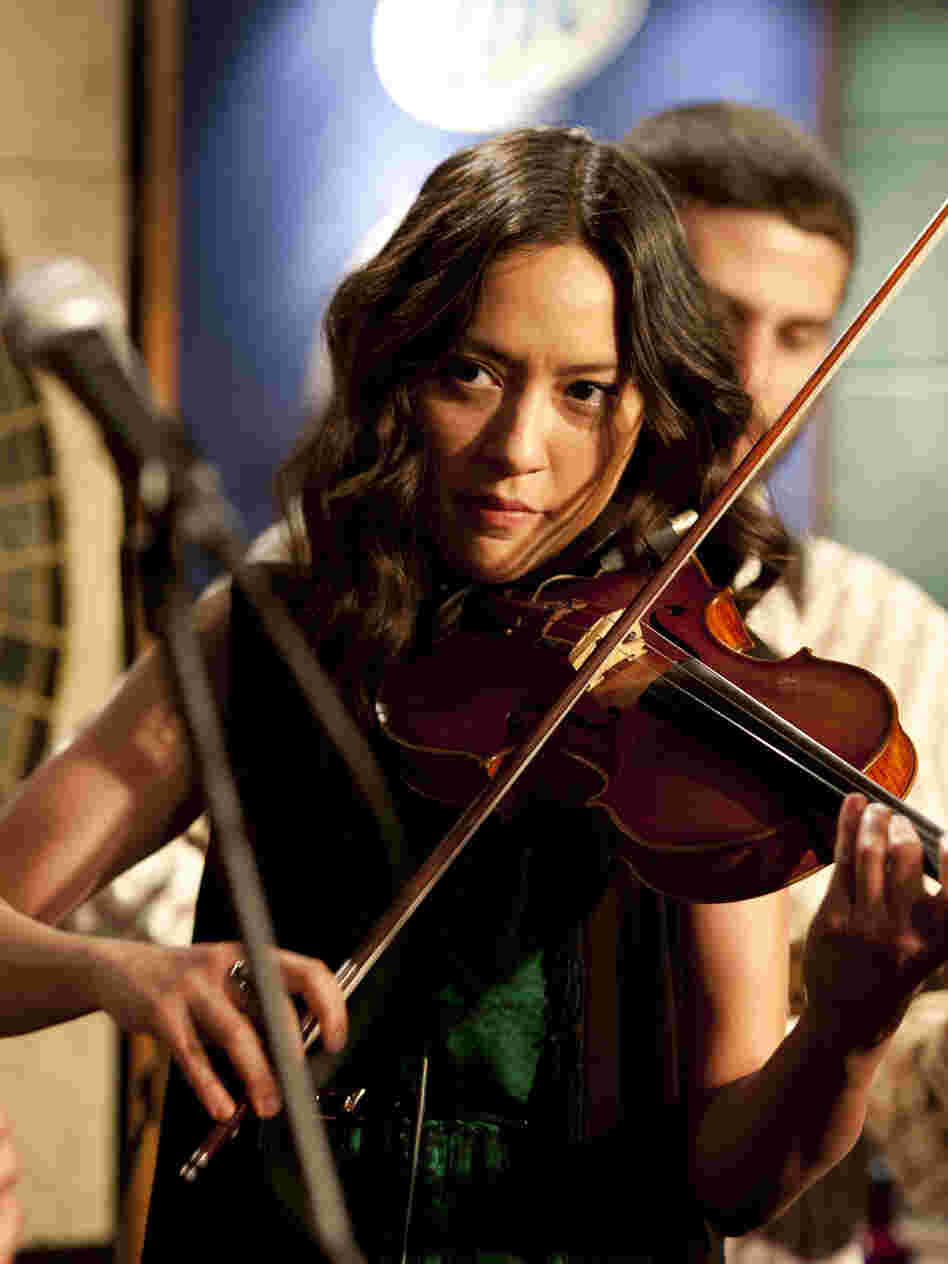 Annie (Lucia Micarelli) invited her parents to see her latest gig.