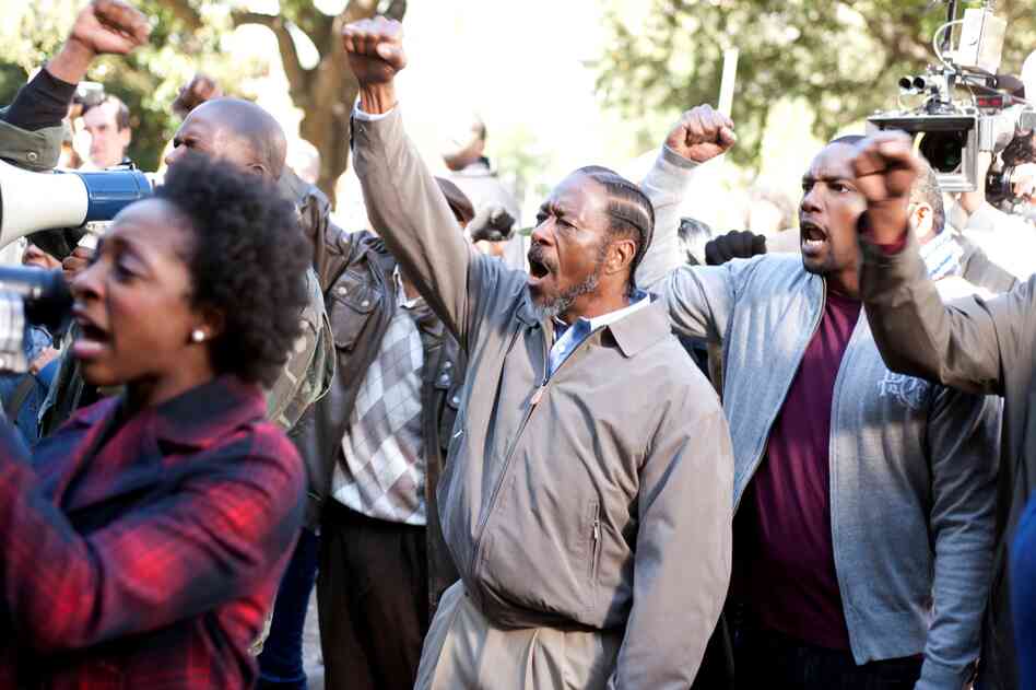 The Lambreaux men protest the demolition of housing projects.