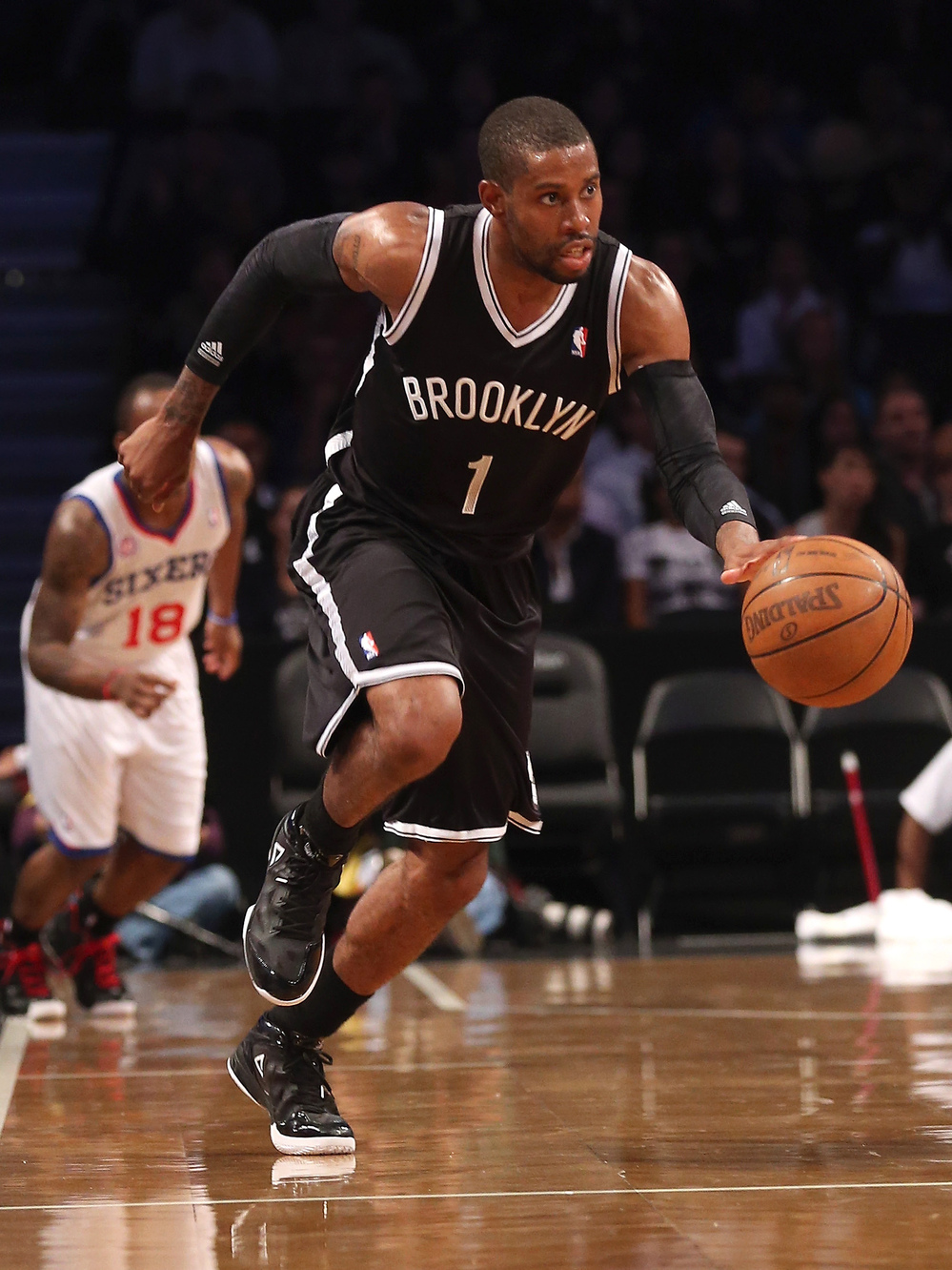 C.J. Watson of the Brooklyn Nets dribbles upcourt in a preseason game against the Philadelphia 76ers. The New York City borough finally has a pro sports team to call its own, says Frank Deford.