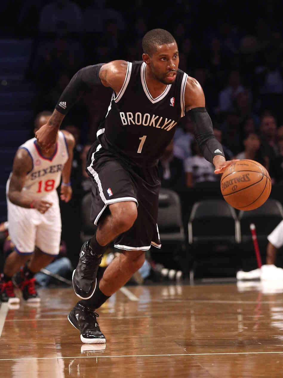 C.J. Watson of the Brooklyn Nets dribbles upcourt in a preseason game against the Philadelphia 76ers. The New York City borough finally has a pro sports team to call its own, says Frank Deford.
