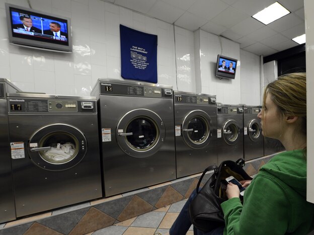 Watch the wash or watch the debate? This woman was at a laundromat in Manhattan during Monday's debate.