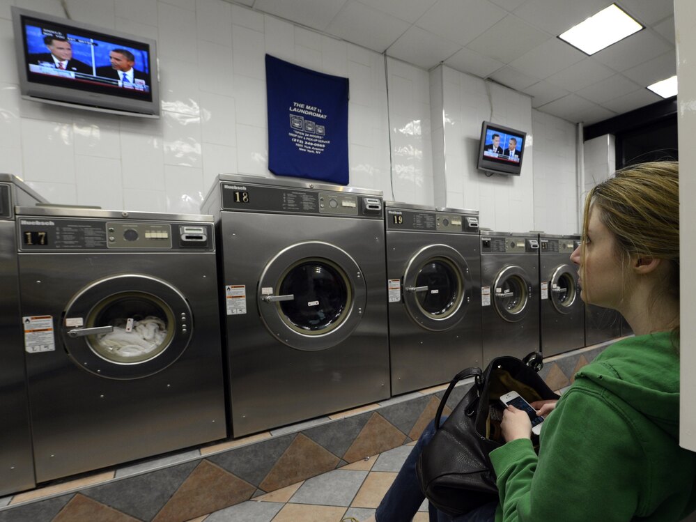 Watch the wash or watch the debate? This woman was at a laundromat in Manhattan during Monday's debate.