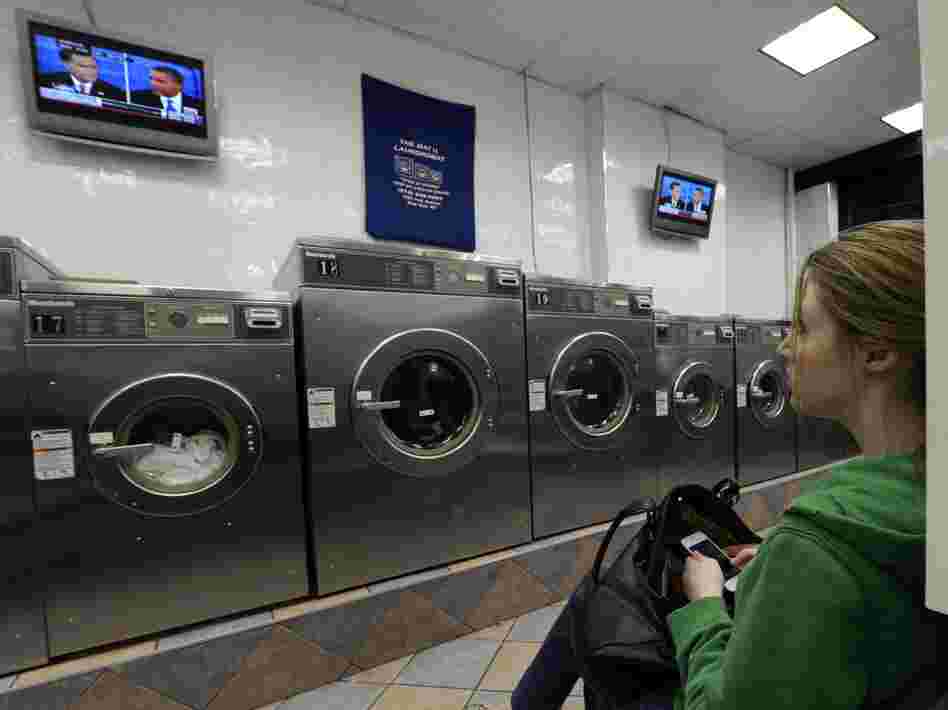 Watch the wash or watch the debate? This woman was at a laundromat in Manhattan during Monday's debate.