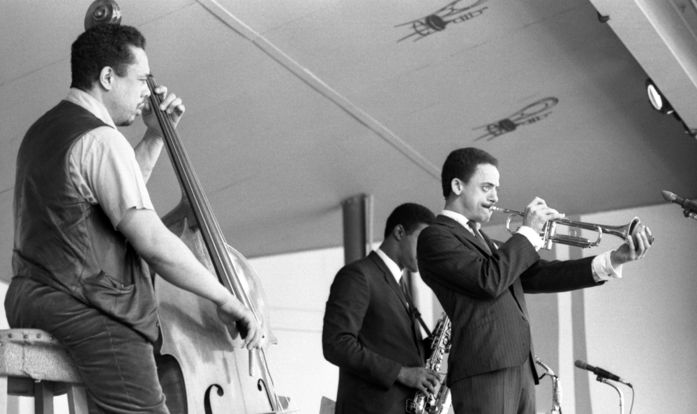 Bassist Charles Mingus leads a band at the 1964 Monterey Jazz Festival, including Lonnie Hillyer (trumpet) and Charles McPherson (alto sax, obscured).