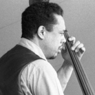 Bassist Charles Mingus leads a band at the 1964 Monterey Jazz Festival, including Lonnie Hillyer (trumpet) and Charles McPherson (alto sax, obscured). Bassist Charles Mingus leads a band at the 1964 Monterey Jazz Festival, including Lonnie Hillyer (trumpet) and Charles McPherson (alto sax, obscured).