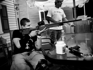 Staback takes aim with a replica sniper rifle on his back porch in Scranton, Pa. After a year at Walter Reed, he's moving into an apartment with a friend near the hospital in Bethesda, Md.