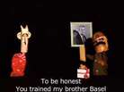 This episode of Top Goon featured the Syrian president on the left, a member of the security forces on the right, and a photo of the former president, Hafez Assad, who is the father of the current leader. This episode of Top Goon featured the Syrian president on the left, a member of the security forces on the right, and a photo of the former president, Hafez Assad, who is the father of the current leader.