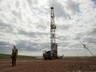 Austin Mitchell walks away from an oil derrick outside Williston, N.D., in July 2011. North Dakota is now the No. 2 producer of oil in the U.S. behind Texas. Austin Mitchell walks away from an oil derrick outside Williston, N.D., in July 2011. North Dakota is now the No. 2 producer of oil in the U.S. behind Texas.