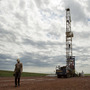 Austin Mitchell walks away from an oil derrick outside Williston, N.D., in July 2011. North Dakota is now the No. 2 producer of oil in the U.S. behind Texas. Austin Mitchell walks away from an oil derrick outside Williston, N.D., in July 2011. North Dakota is now the No. 2 producer of oil in the U.S. behind Texas.