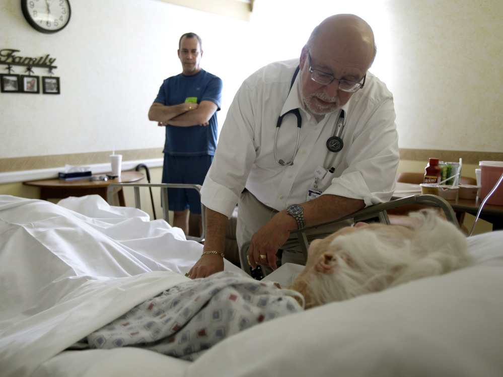 Dr. Joel Policzer checks on his patient, Lillian Landry, in the hospice wing of an Florida hospital in 2009. A new study found that many terminally ill cancer patients don't fully understand their prognosis.