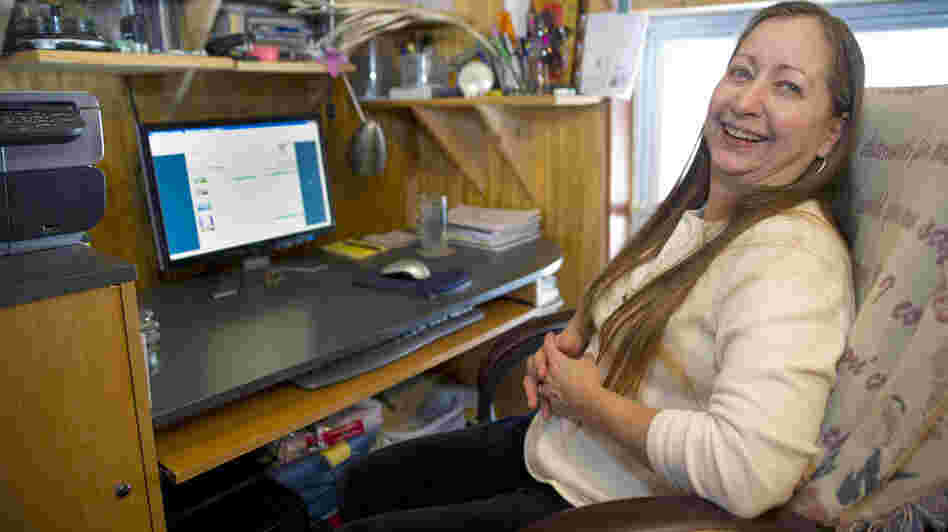In much of America, the availability of online video is often frustrated by slow broadband speeds. In this 2011 photo, Valerie Houde waits for a dial-up Internet connection in East Burke, Vt.