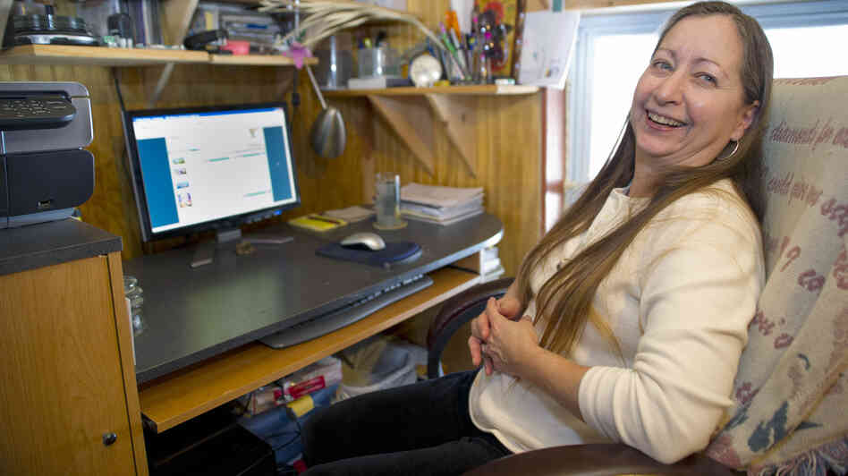 In much of America, the availability of online video is often frustrated by slow broadband speeds. In this 2011 photo, Valerie Houde waits for a dial-up Internet connection in East Burke, Vt.