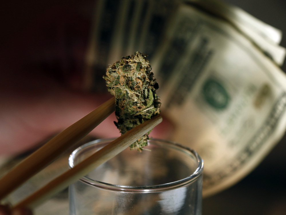 A marijuana bud at a marijuana dispensary in Denver. Colorado, Oregon and Washington could become the first to legalize marijuana this fall.