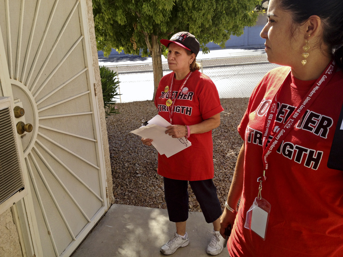 Culinary Union members Emilia Cabrera (left) and Dallany Santos canvass in Las Vegas for the union's get-out-the-vote effort for President Obama.