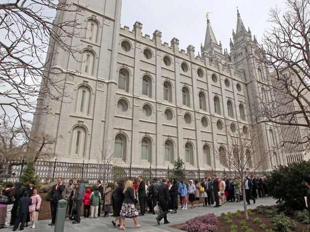 Mormons line up outside the historic Salt Lake Temple before the church's general conference in 2010.