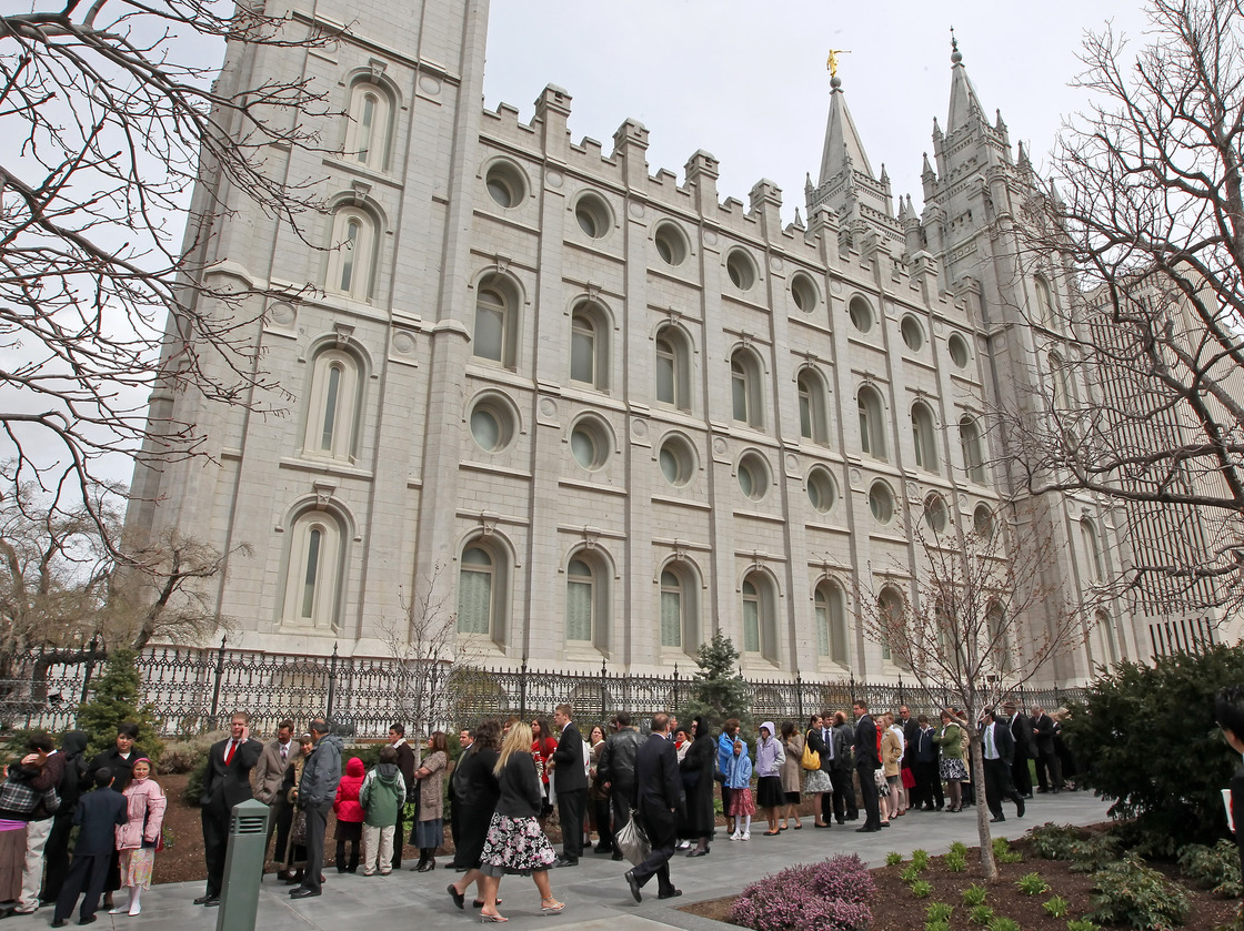 Mormons line up outside the historic Salt Lake Temple before the church's general conference in 2010.