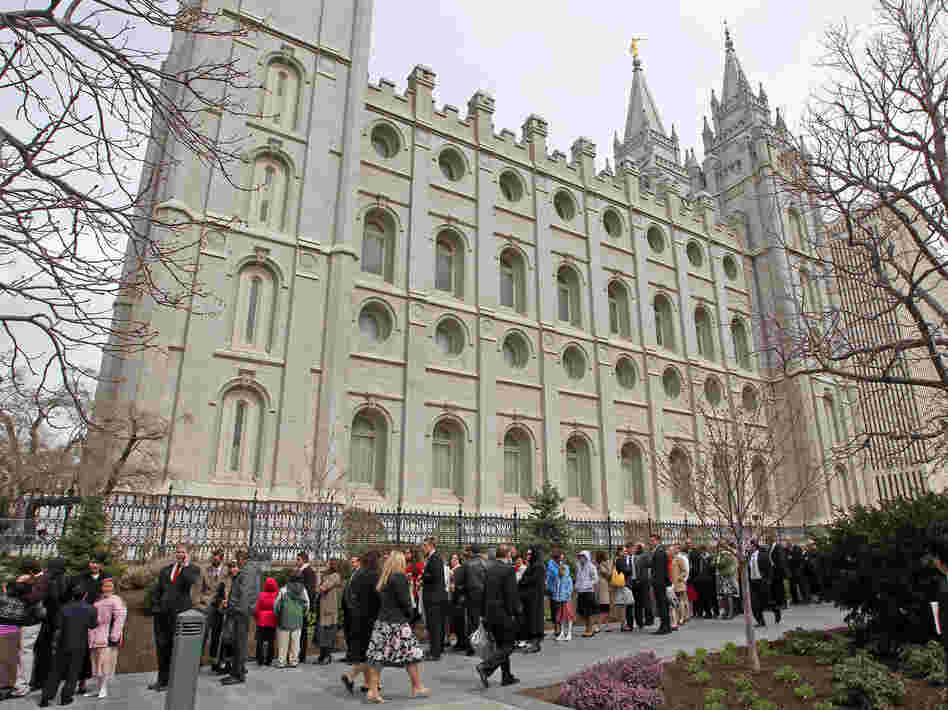 Mormons line up outside the historic Salt Lake Temple before the church's general conference in 2010.