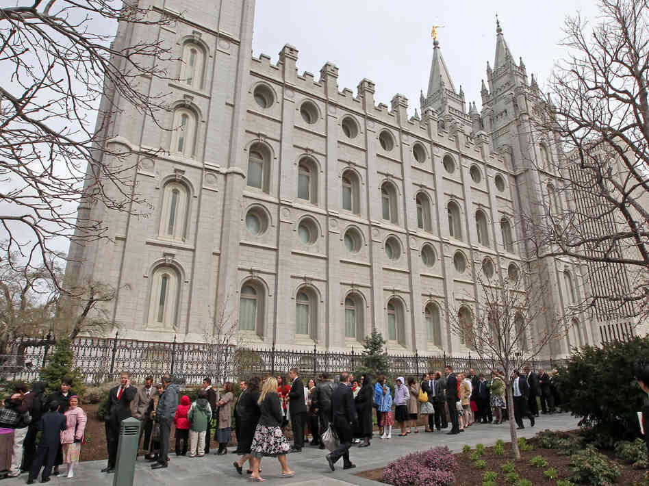 Mormons line up outside the historic Salt Lake Temple before the church's general conference in 2010.