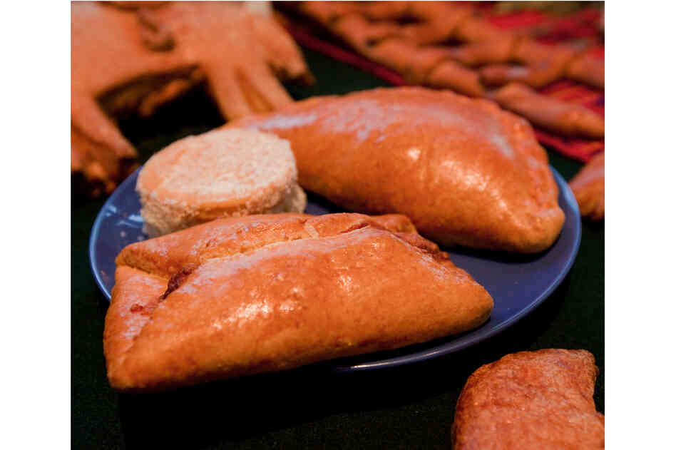 Pan de Muertos: Semisweet breads are baked with a small human figurine inside. It's considered good luck to find the tiny surprise in your slice. Breads are also used to represent the soil. Pan de Muertos: Semisweet breads are baked with a small human figurine inside. It's considered good luck to find the tiny surprise in your slice. Breads are also used to represent the soil.