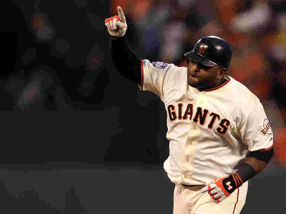 San Francisco Giants third baseman Pablo Sandoval rounding the bases after one of his three home runs last night.
