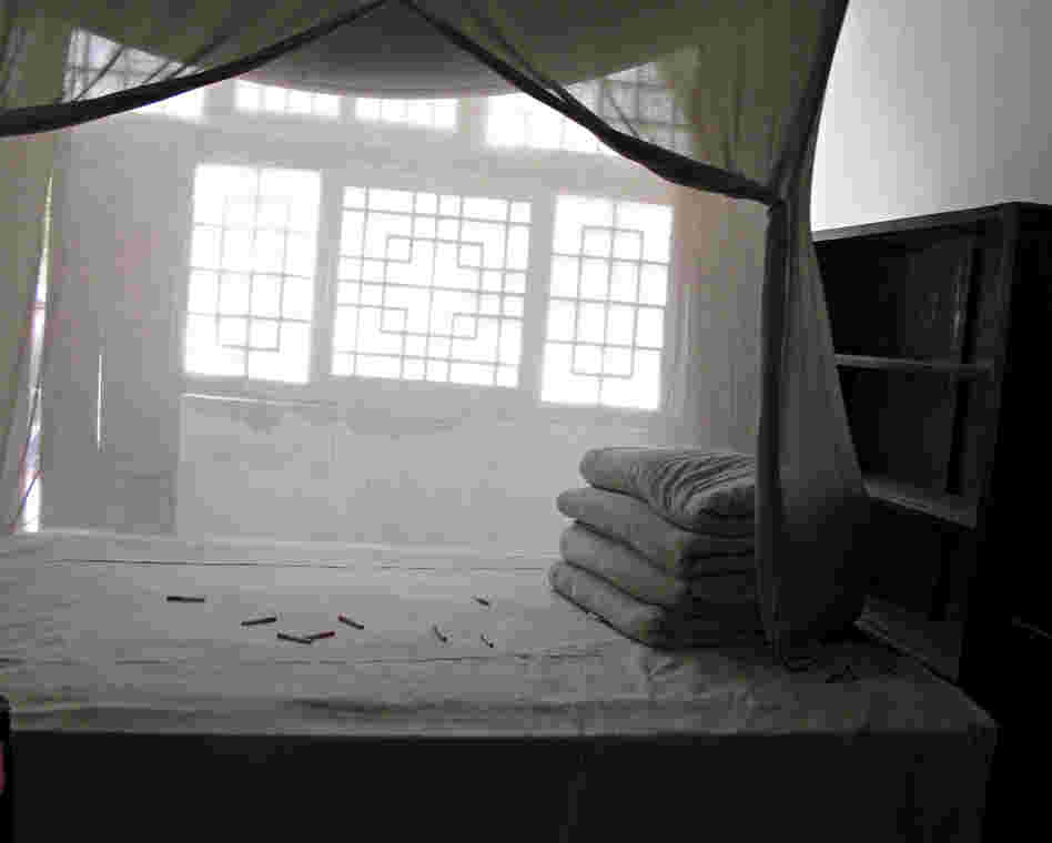 As a tribute to Mao, enthusiastic tourists have thrown cigarettes onto the bed in his former cave dwelling.