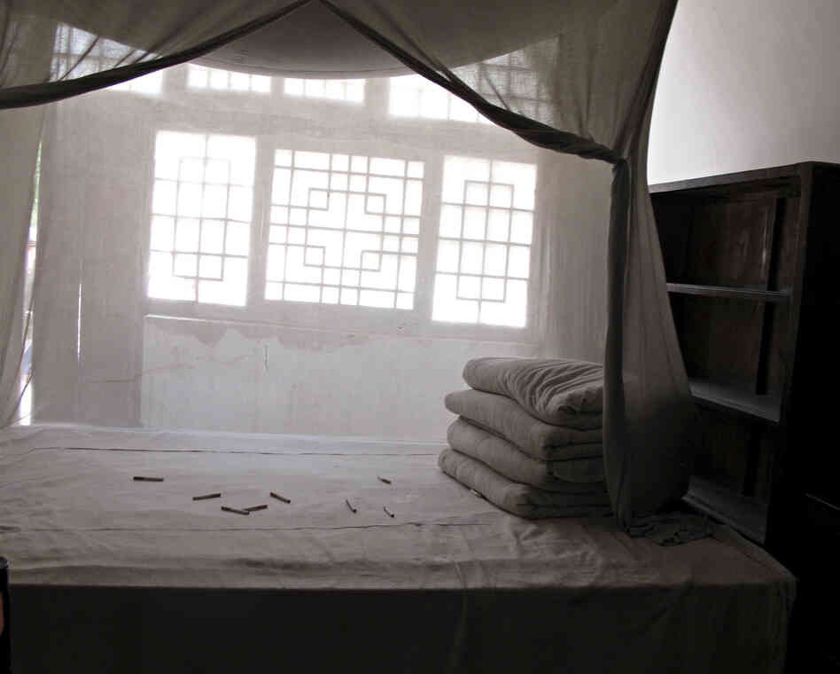 As a tribute to Mao, enthusiastic tourists have thrown cigarettes onto the bed in his former cave dwelling.