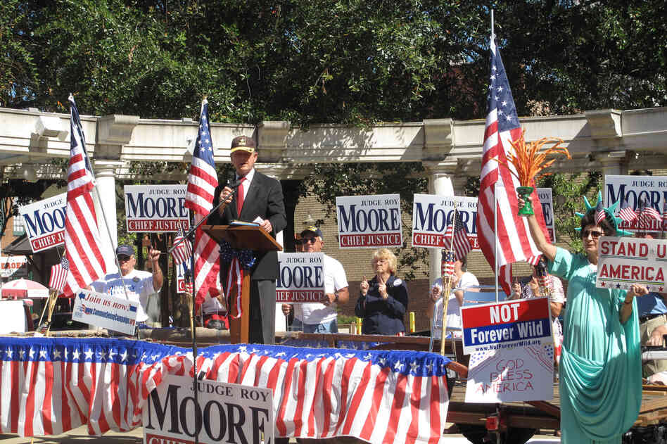Former Alabama Chief Justice Roy Moore, known as the "Ten Commandments Judge," makes an appearance at a Tea Party rally in Mobile. The Republican is running for chief justice again despite being removed from the office nearly 10 years ago for defying a federal court order to remove a massive Ten Commandments monument from the Alabama judicial building.