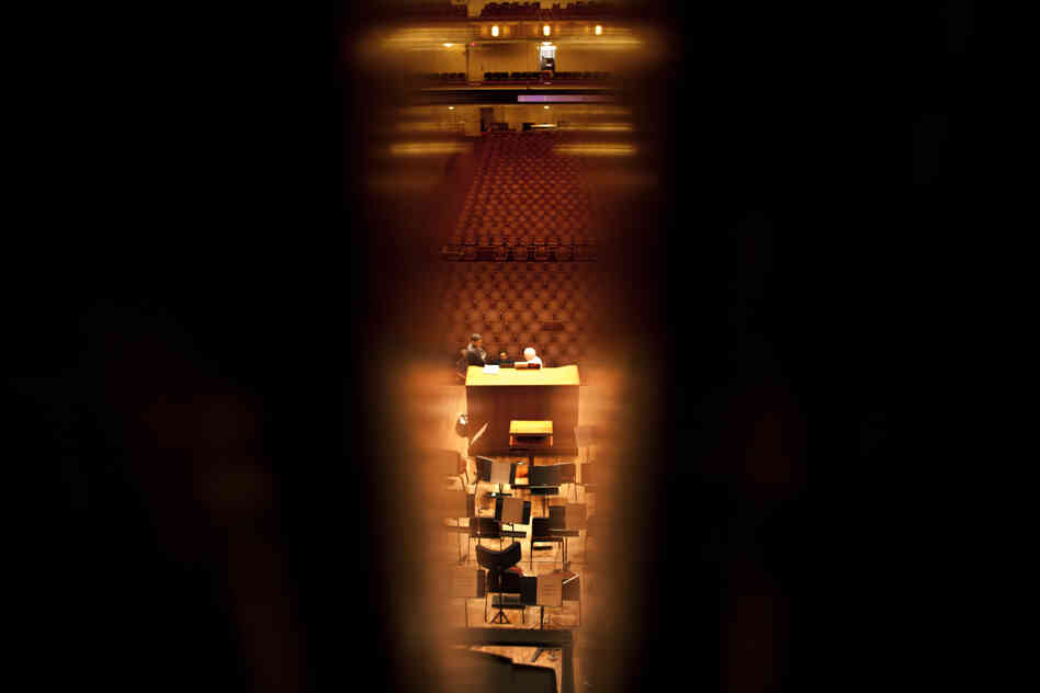The organ console and concert hall as seen through the pipes of the organ chamber set behind the orchestra. The new organ boasts 1,000 more pipes than the previous one — nearly 5,000 pipes in total.