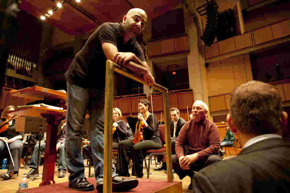 Bahl (left) speaks with Neil (center) and Weiler about the organ's test performance with the orchestra on Oct. 18. After six weeks of toning and tuning, the team just needed to make a few final refinements. "We had to tone it down today. We heard too much organ," said Weiler. "It's much easier to make an organ softer than louder, but the power is there."