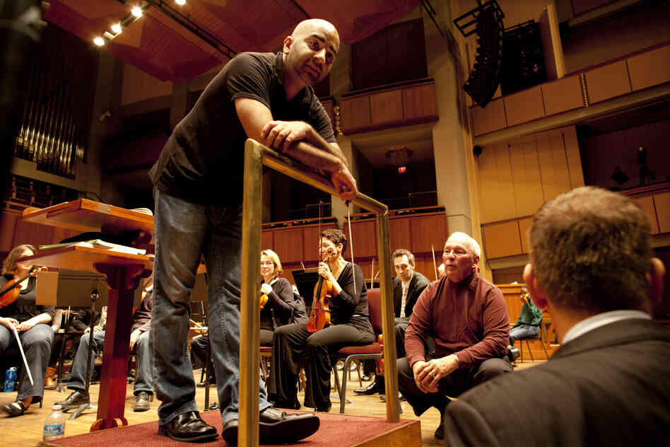 Bahl (left) speaks with Neil (center) and Weiler about the organ's test performance with the orchestra on Oct. 18. After six weeks of toning and tuning, the team just needed to make a few final refinements. "We had to tone it down today. We heard too much organ," said Weiler. "It's much easier to make an organ softer than louder, but the power is there."