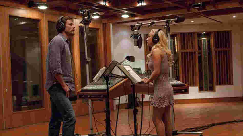 Nashville veteran Deacon (Charles Esten) and upstart country-pop star Juliette (Hayden Panettiere) record a duet in a scene from ABC's Nashville.