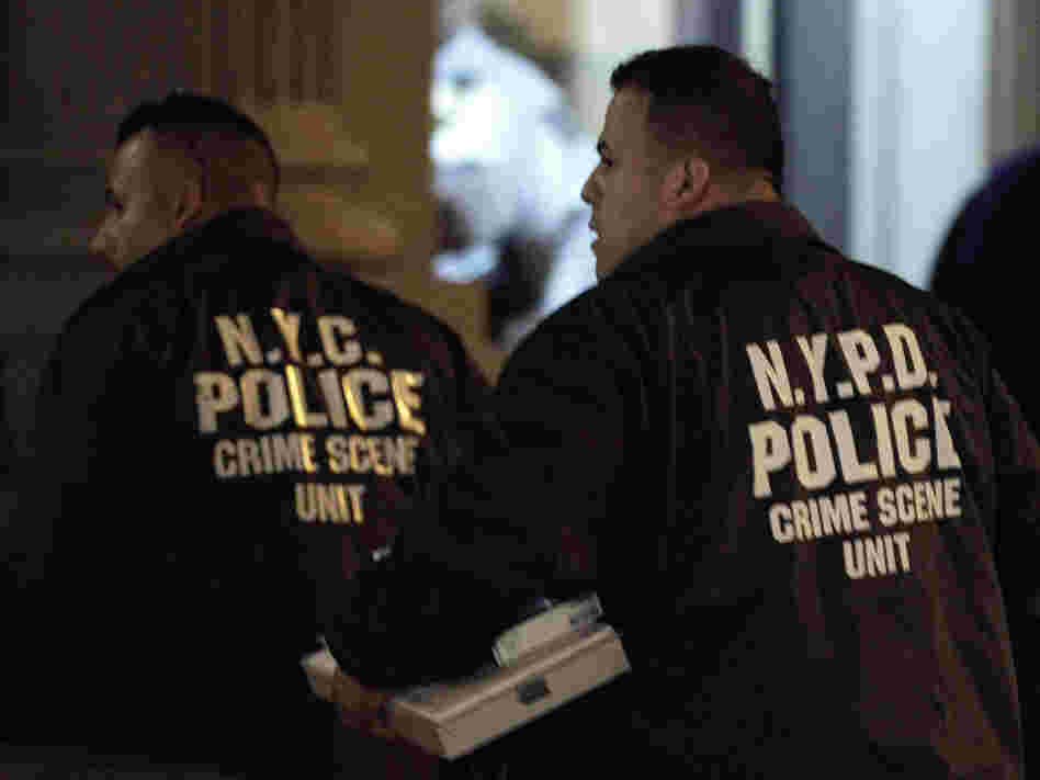 Crime scene unit officers outside the Manhattan apartment building where the children were killed Thursday.