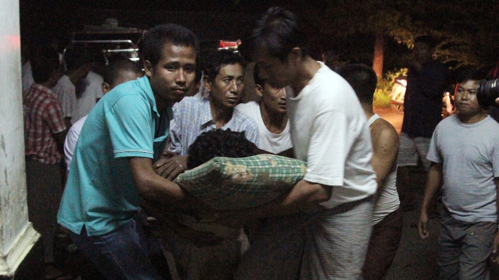An injured Rakhine Buddhist is taken to the hospital following violence in Rakhine state, Myanmar.