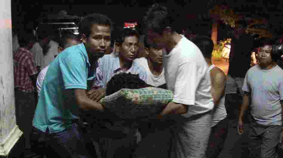 An injured Rakhine Buddhist is taken to the hospital following violence in Rakhine state, Myanmar.