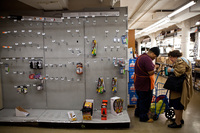 A Home Depot employee helps a customer Sunday in New York.