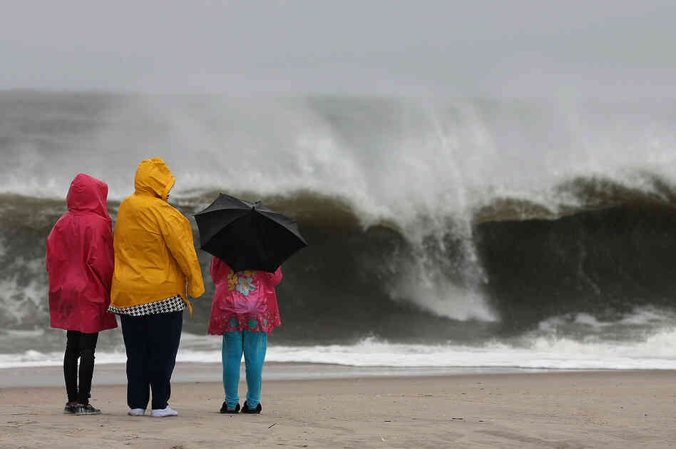 The approaching Hurricane Sandy causes heavy surf in Cape May, N.J., on Sunday. Hurricane Sandy is expected to hit the New Jersey coastline sometime Monday, bringing heavy winds and floodwaters.
