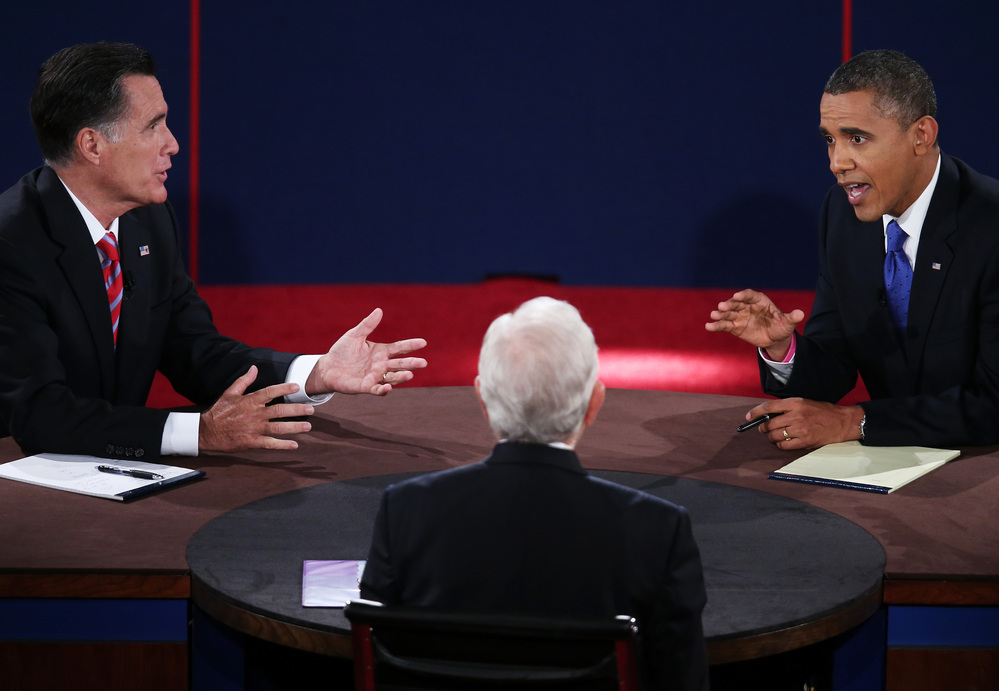 President Barack Obama (R) debates with Republican presidential candidate Mitt Romney (L) as moderator Bob Schieffer listens on Oct. 22, 2012.
