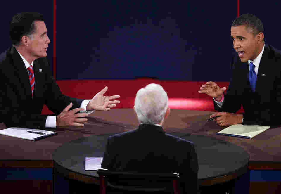 President Barack Obama (R) debates with Republican presidential candidate Mitt Romney (L) as moderator Bob Schieffer listens on Oct. 22, 2012.