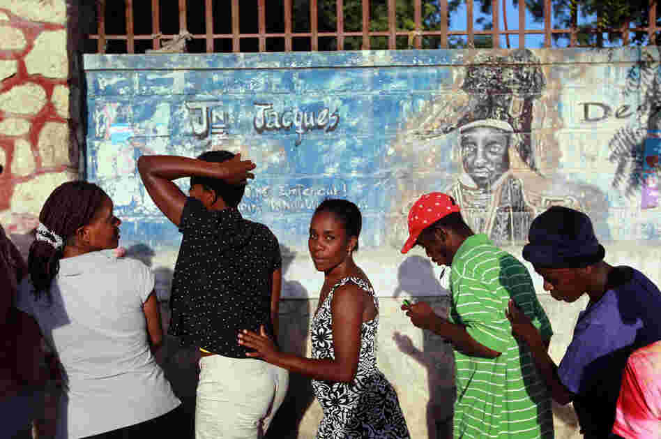 People wait to vote in Haiti's national election in Port-au-Prince, 2010.