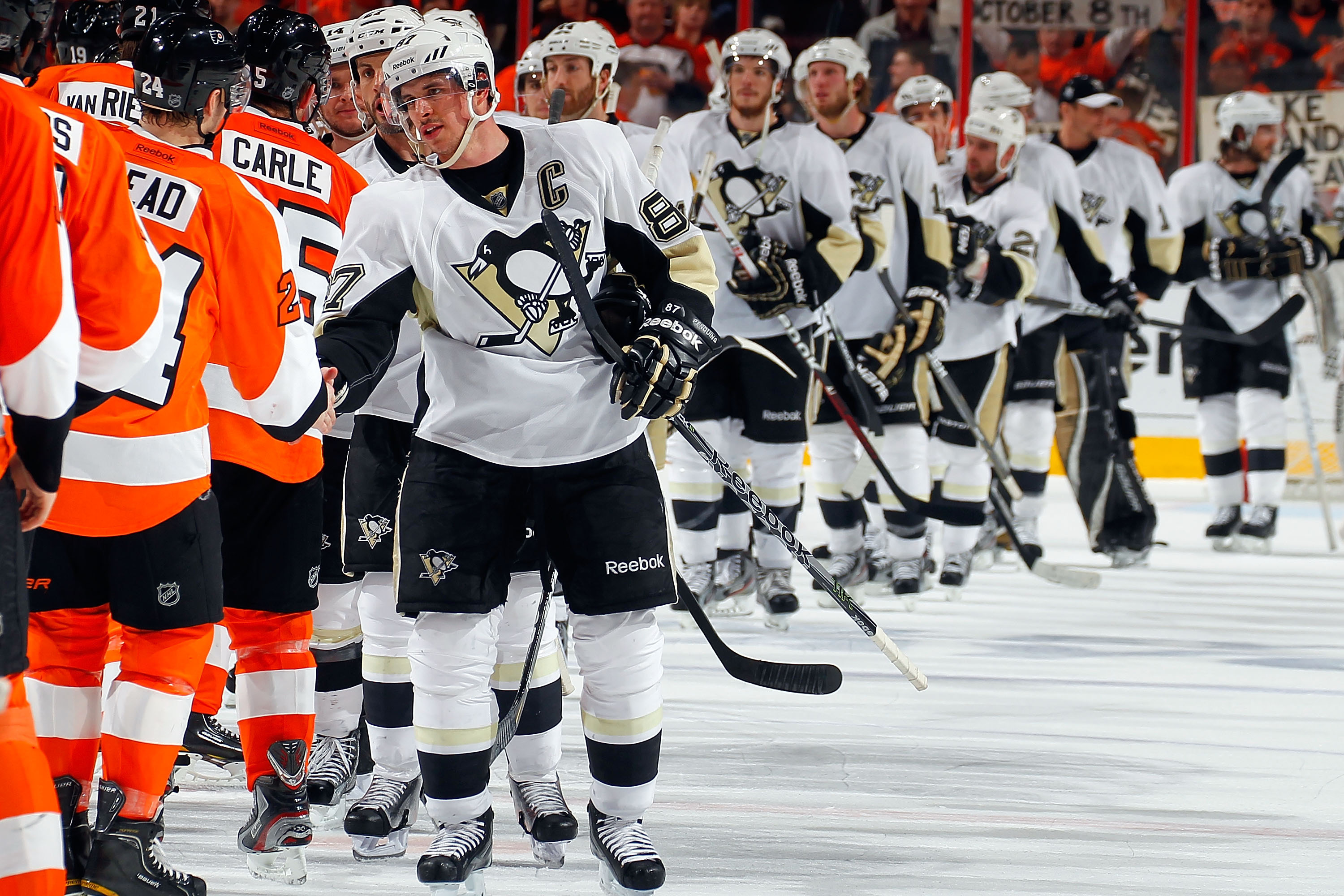 The Pittsburgh Penguins line up to shake hands with the Philadelphia Flyers post-hockey match, 2012. (Image credit: Getty Images)