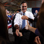 Mitt Romney greets supporters Sunday during a campaign rally in Findlay, Ohio.
