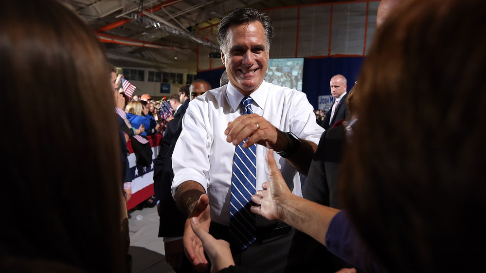 Mitt Romney greets supporters Sunday during a campaign rally in Findlay, Ohio.