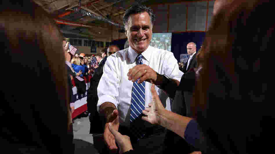 Mitt Romney greets supporters Sunday during a campaign rally in Findlay, Ohio.