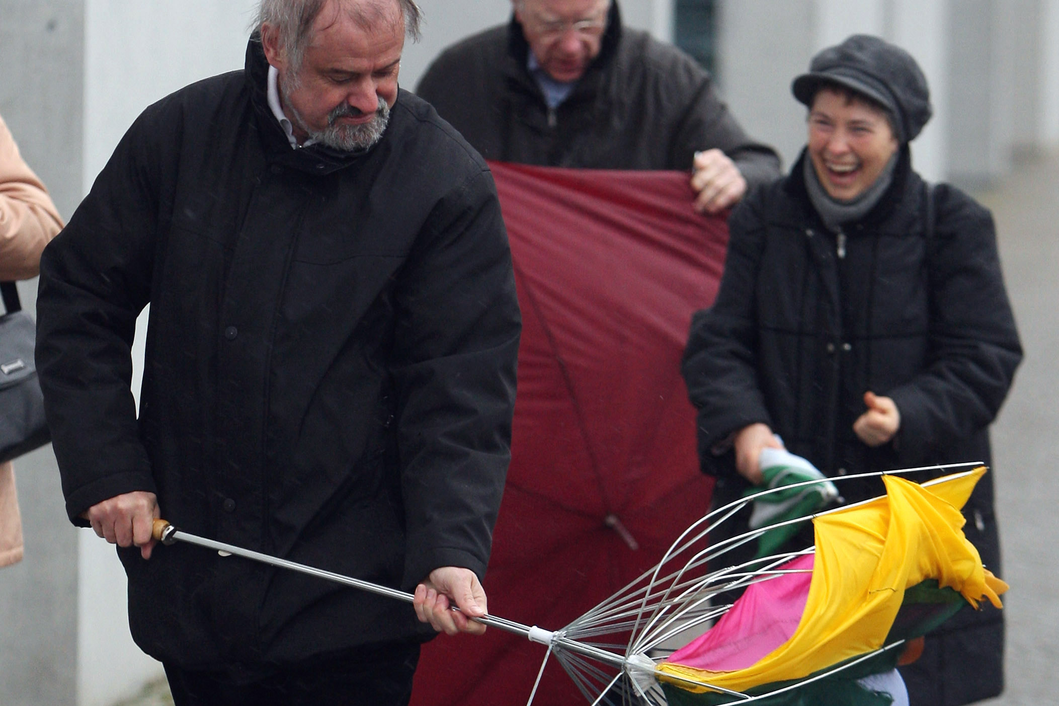 A man in Germany gets no sympathy during Emma — another storm with hurricane-strength winds, in 2008.