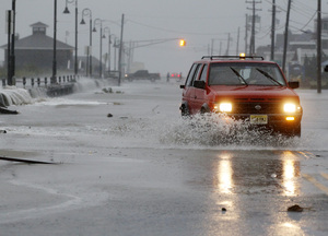 Rough surf breaks over the beach in Cape May, N.J.