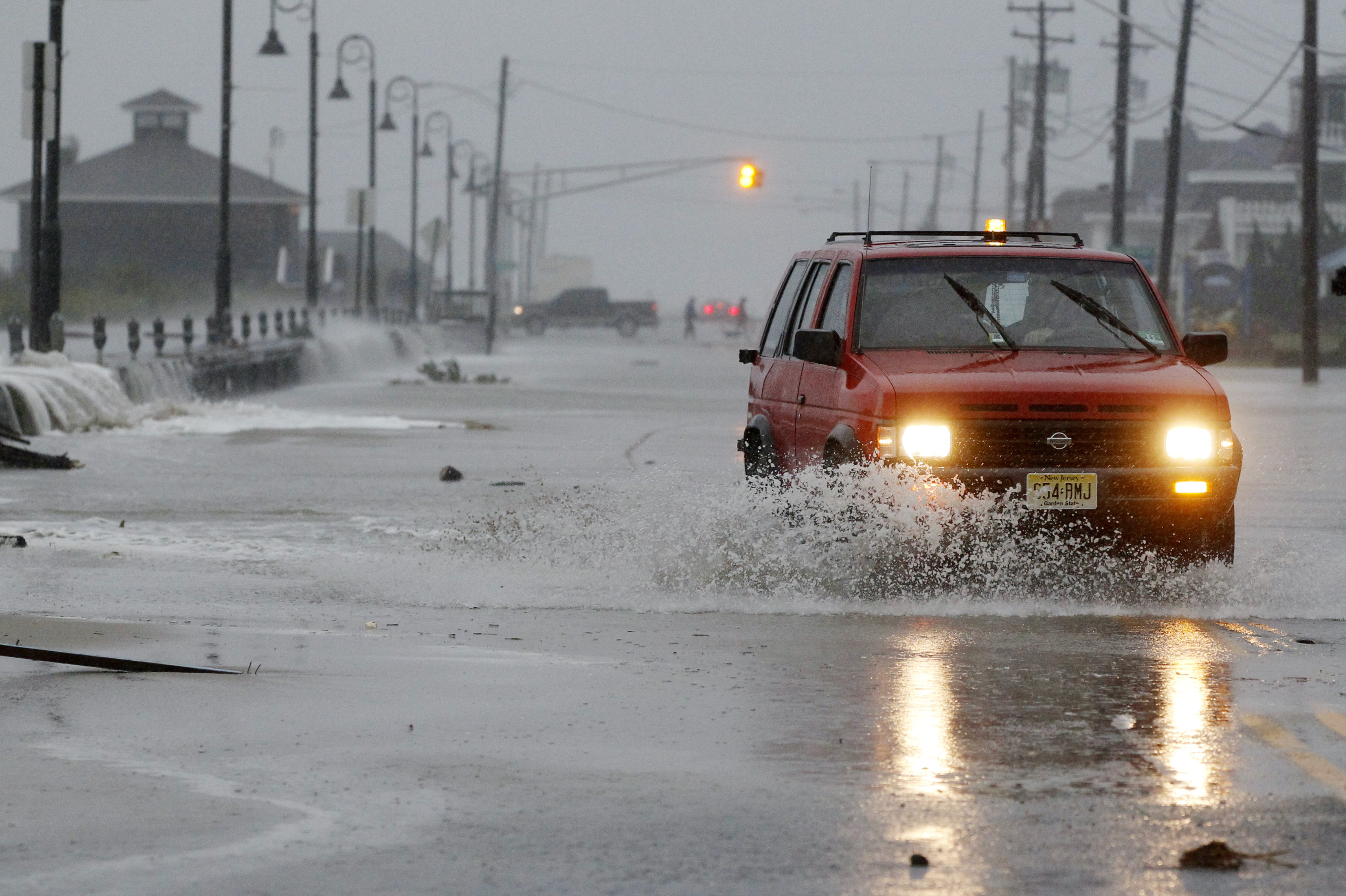 Rough surf breaks over the beach in Cape May, N.J.