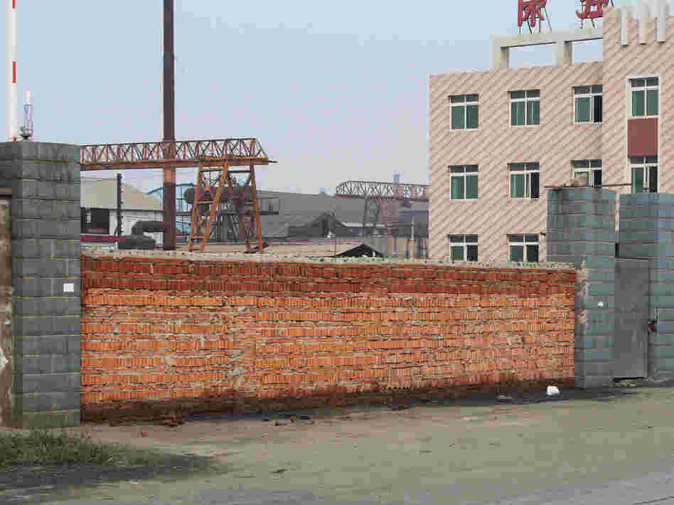 China faces overcapacity in various industries, including steel. This steel mill in the northern city of Tangshan went bankrupt in August after it expanded too quickly and the boss ending up owing banks more than $120 million. Authorities sealed the front gate with bricks.