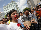 A bloodied woman is helped by demonstrators after clashes with police in a protest against an industrial waste pipeline in Qidong, Jiangsu province, on July 28. The Chinese government devotes enormous resources to suppressing dissent, but opposition to government policies is increasingly common. A bloodied woman is helped by demonstrators after clashes with police in a protest against an industrial waste pipeline in Qidong, Jiangsu province, on July 28. The Chinese government devotes enormous resources to suppressing dissent, but opposition to government policies is increasingly common.