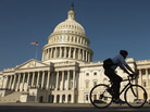A bicyclist rides through the plaza on the east side of the U.S. Capitol in Washington, D.C. A bicyclist rides through the plaza on the east side of the U.S. Capitol in Washington, D.C.